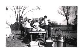 Washing artifacts on Mackenzie Site, ca. 1947