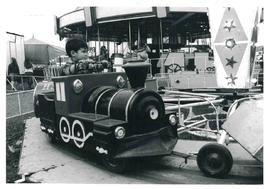 Child riding train, n.d.